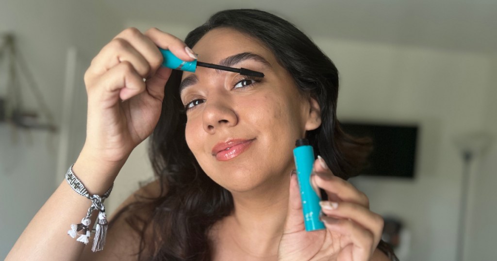 woman applying mascara