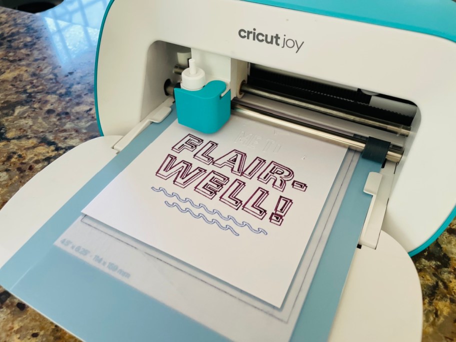 A cricut joy printing a flair-well sign for a teacher appreciation gift