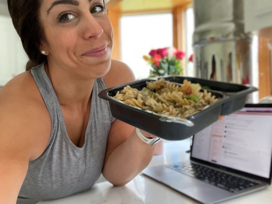 Woman holding a Factor frozen meal tray