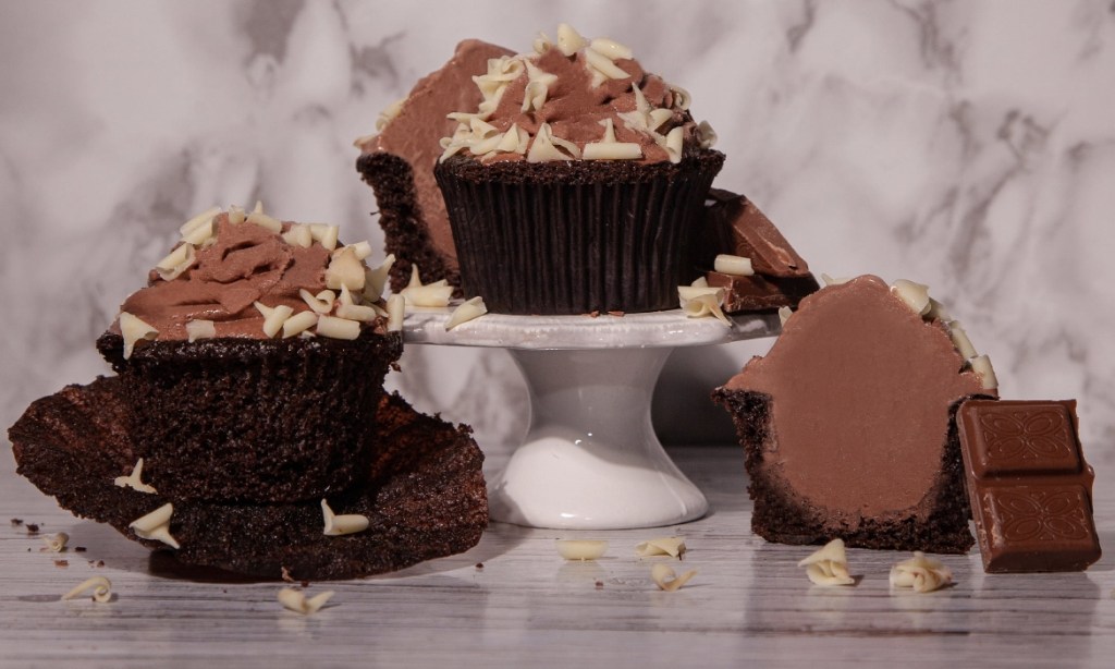 Chocolate cupcakes with sprinkles and chocolate ice cream in the middle