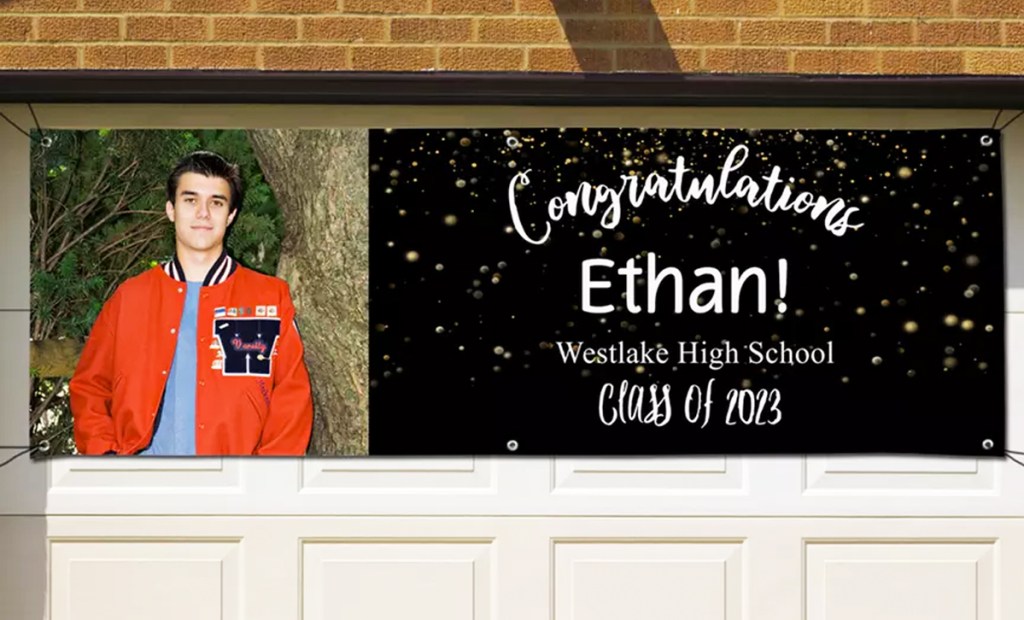 graduation banner hung on garage door