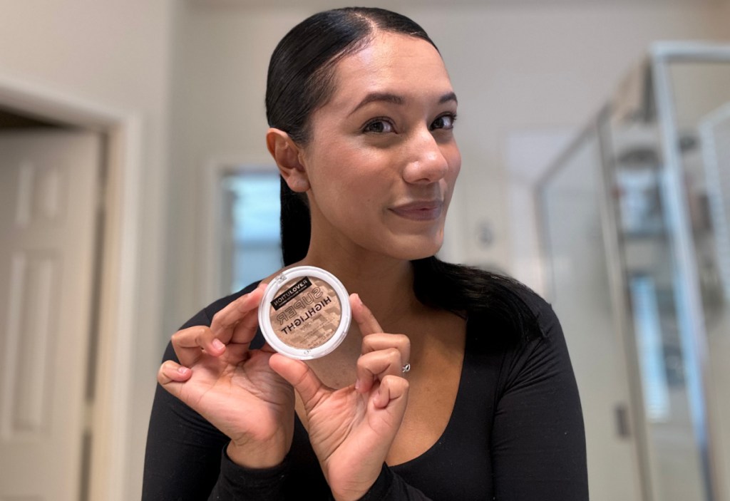 Woman holding Walmart makeup