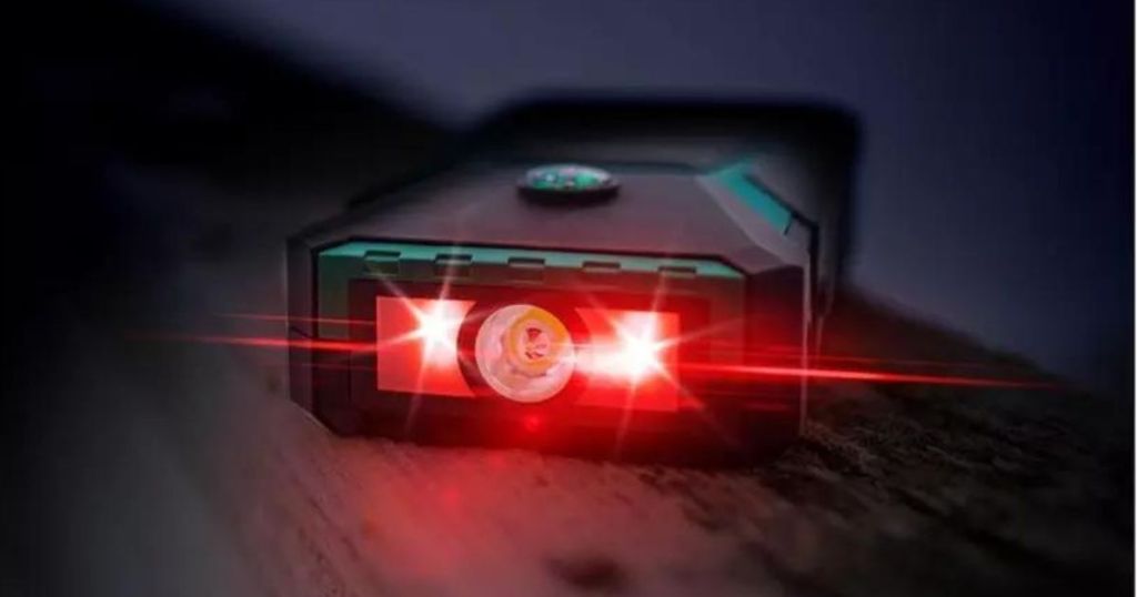 green and black flashlight on car jumper