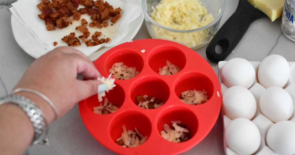 adding gruyere cheese to mold