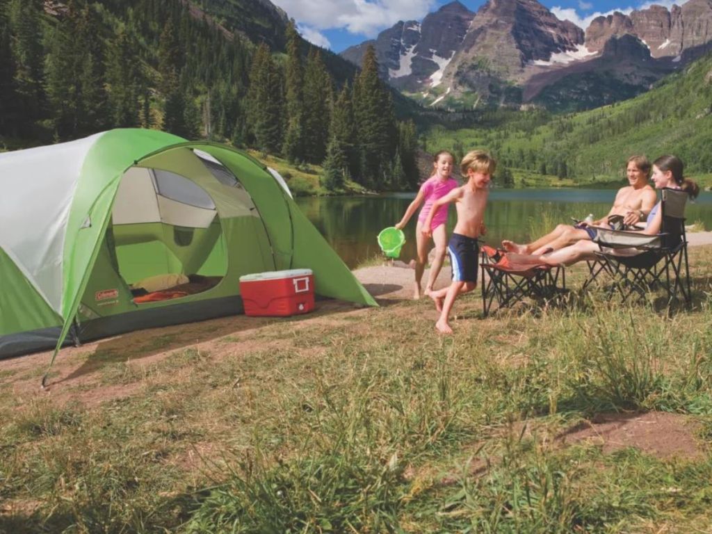 green coleman tent in mountains