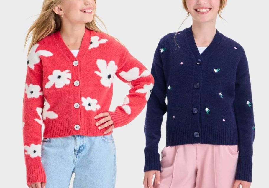 two girls wearing cardigans stock image