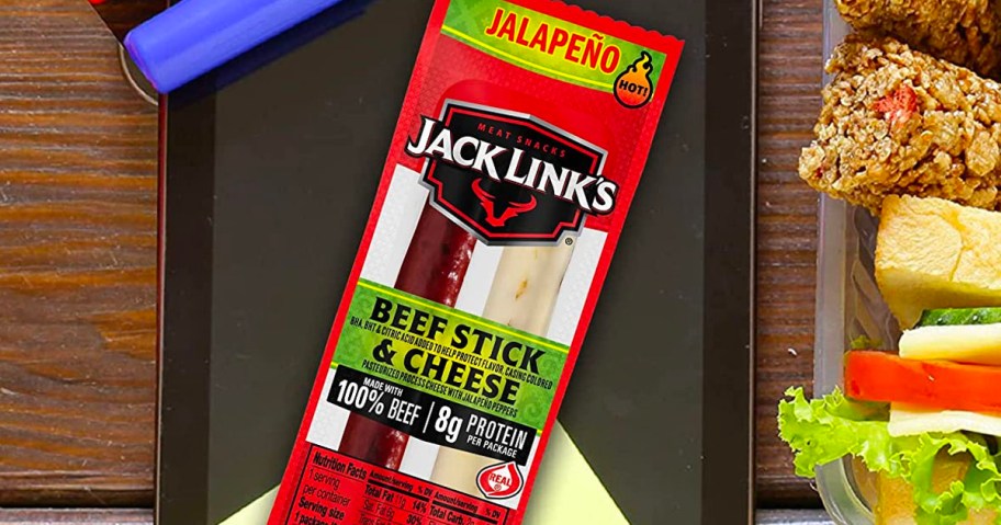 jack links beef stick with cheese pack on table next to sandwich