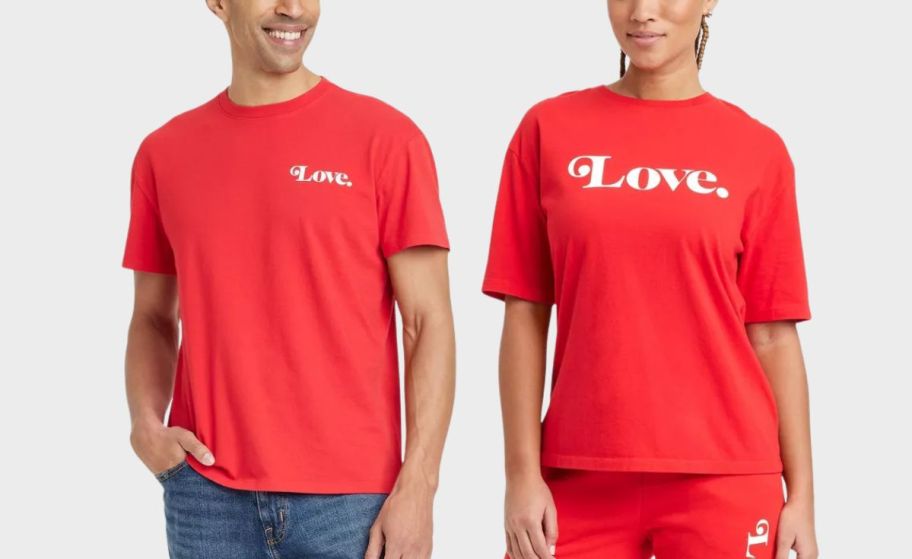 two adults wearing matching family tees stock image