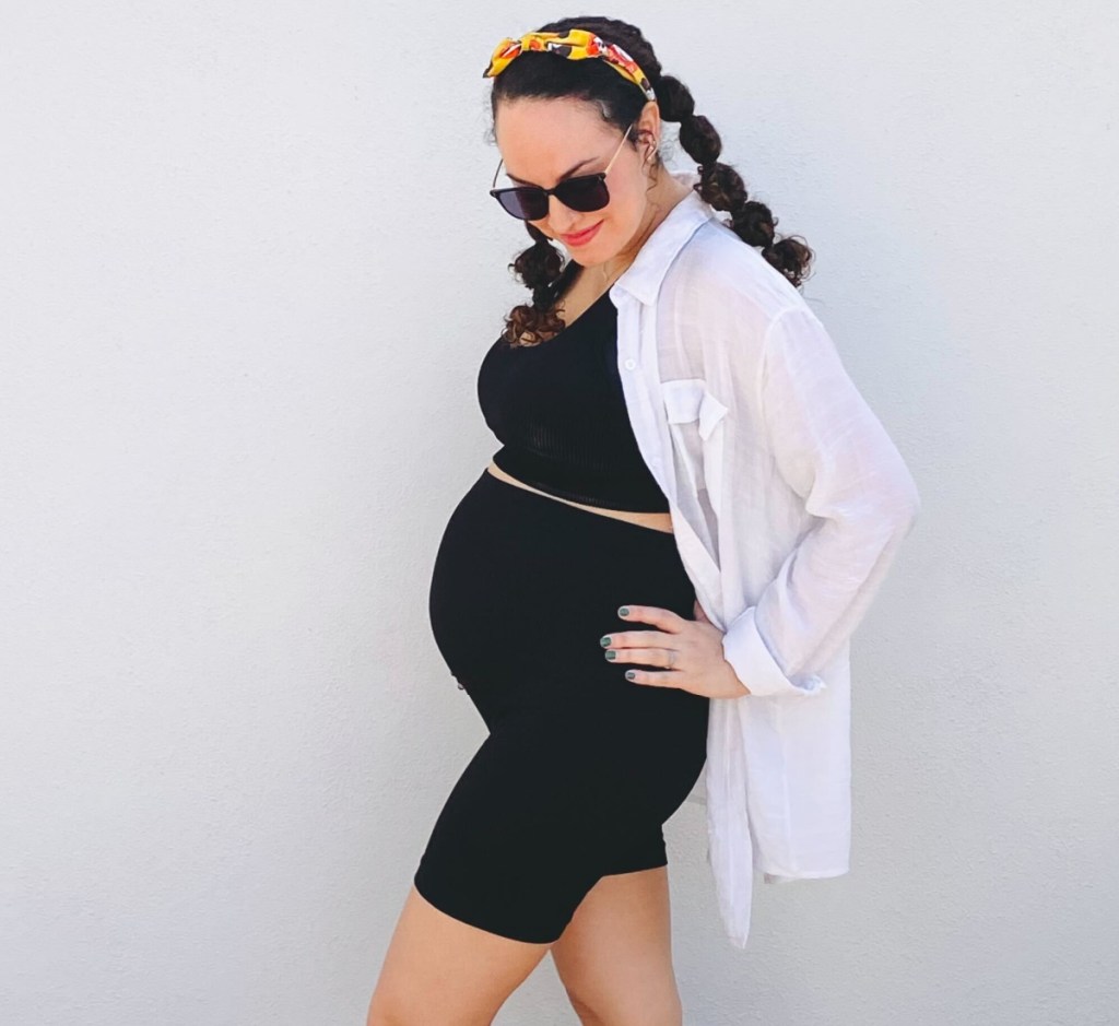 pregnant woman in black sports bra and matching short set