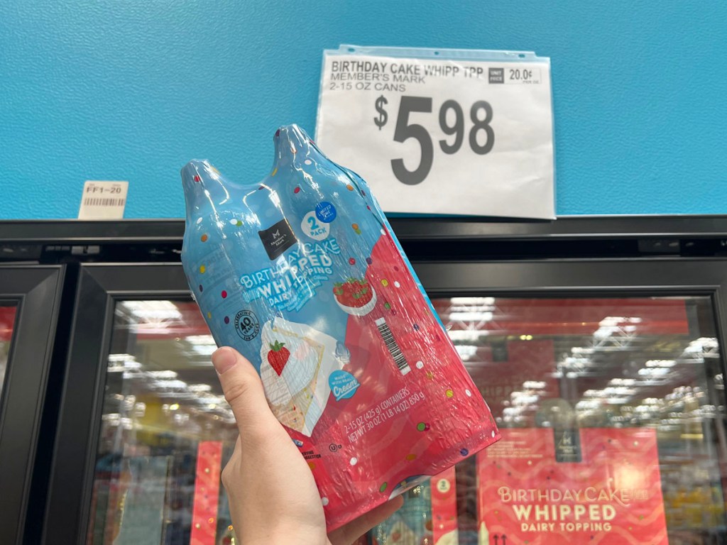 hand holding members mark birthday cake whipped topping in sams club