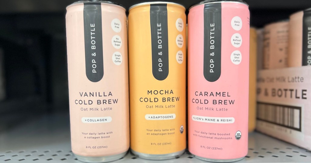 three pop & bottle latte cans on shelf in walmart