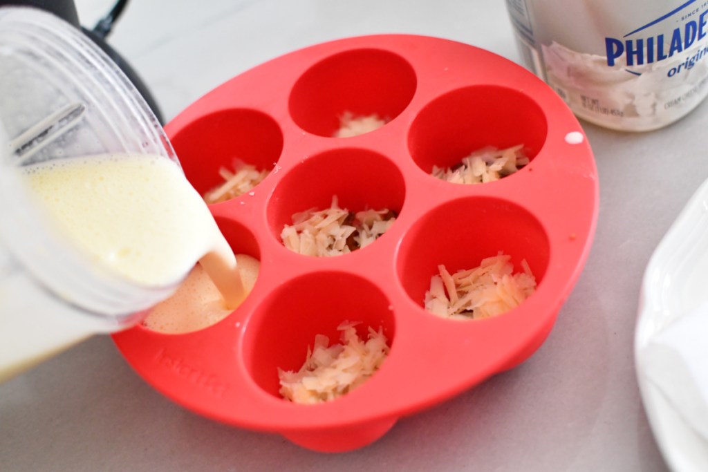 pouring egg mixture into egg bites mold