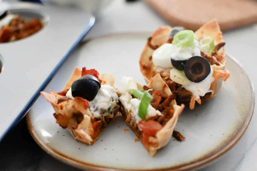 two taco cups on a small plate