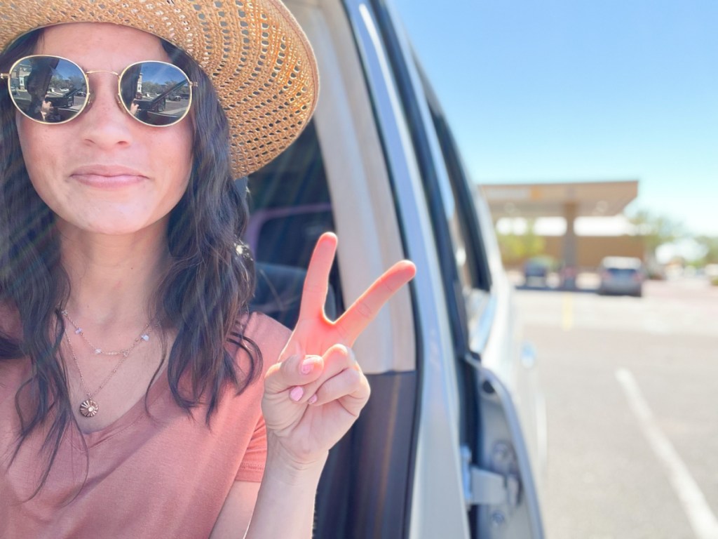 woman in car at Walmart gas staion