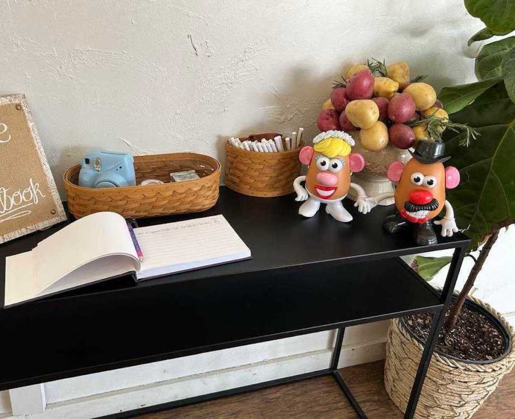 wedding guest book table with potato bouquet 