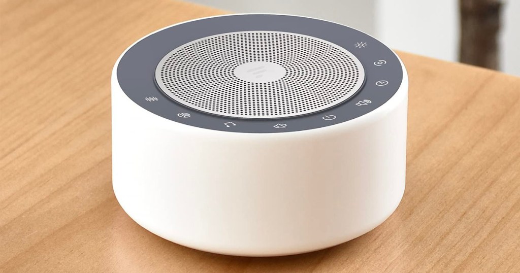 white noise machine sitting on table