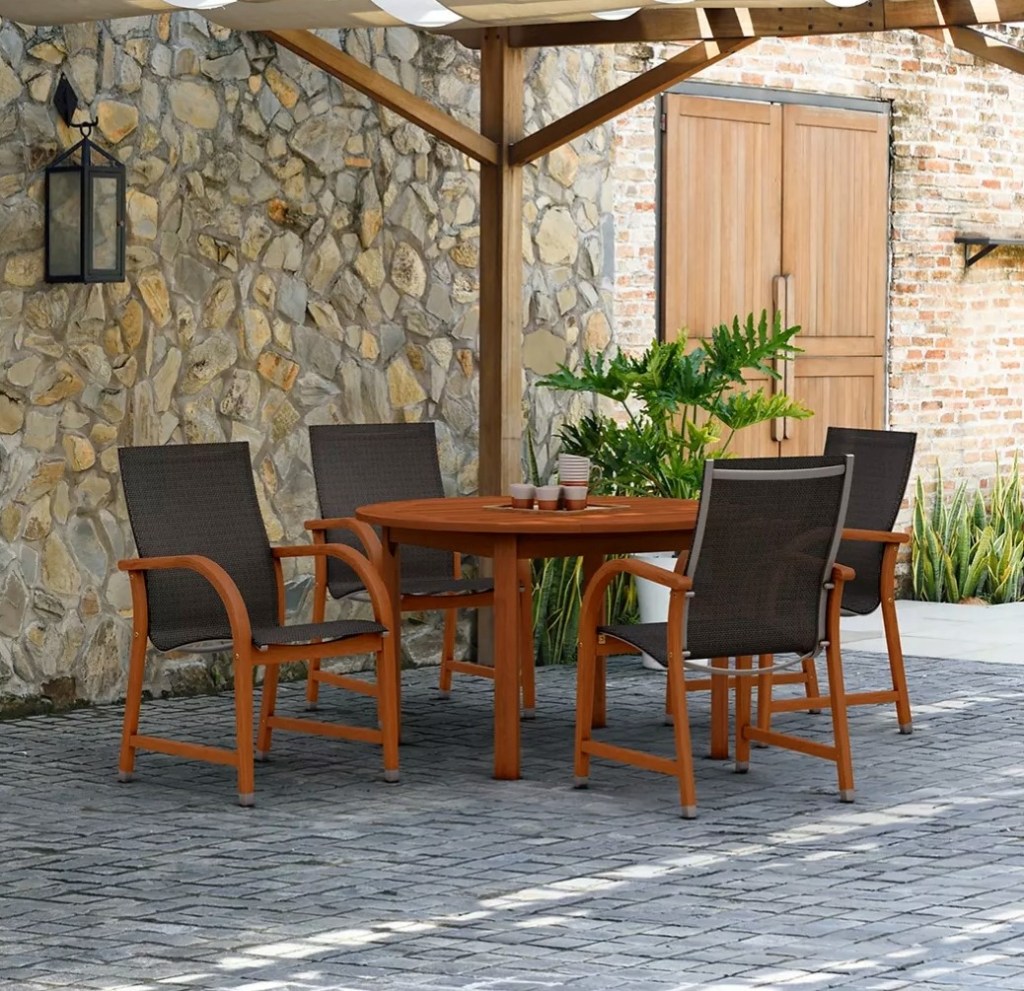 Wood patio dining set next to a house