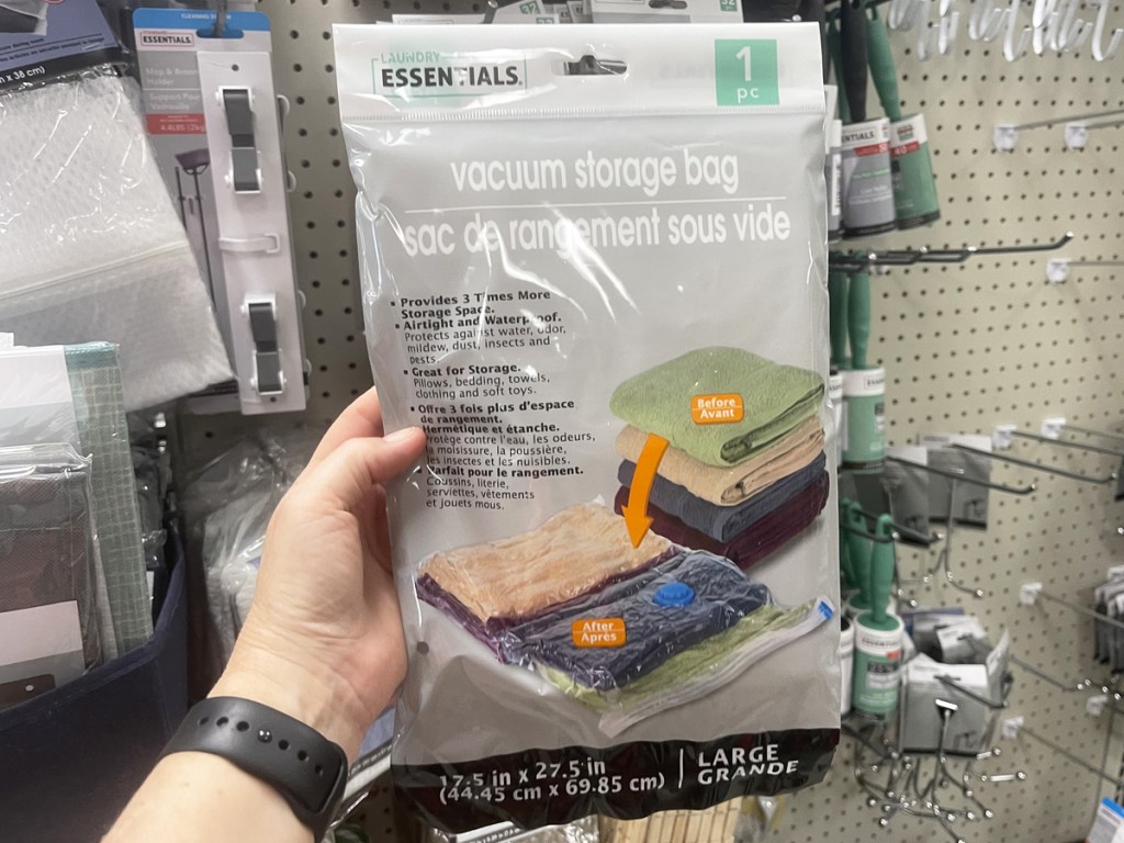 hand holding pack of vacuum storage bags