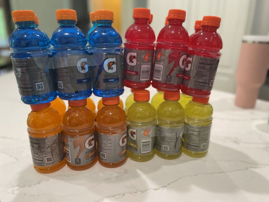 Four packs of Gatorade bottles on a counter