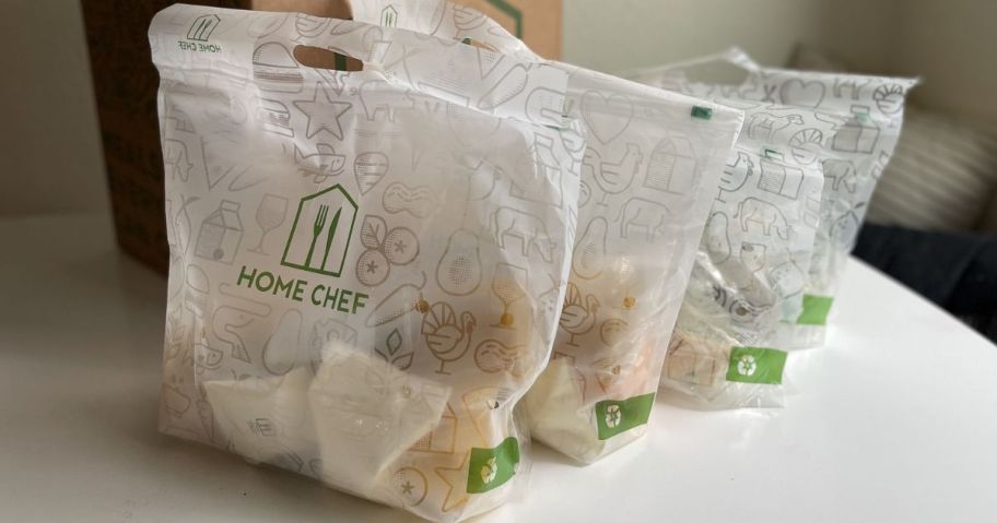 three Bags of prepacked meal kits from Home Chef