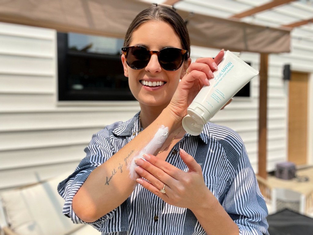 Woman applying Josie Maran Whipped Argan Oil Butter Butter Sunscreen on her arm