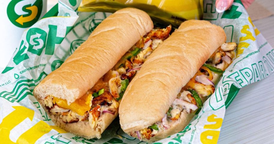 Subway Series Sandwich in a basket lined with Subway paper and a bag of lay's chips