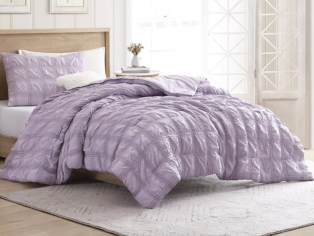 purple quilted onlineforter set on bed