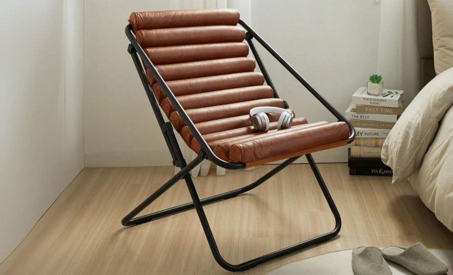 a brown ribbed PU leather sling chair in a bedroom