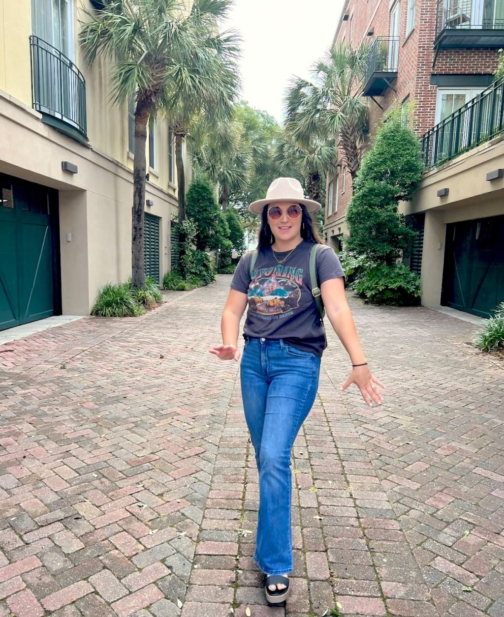 woman posing in alleyway in charleston 