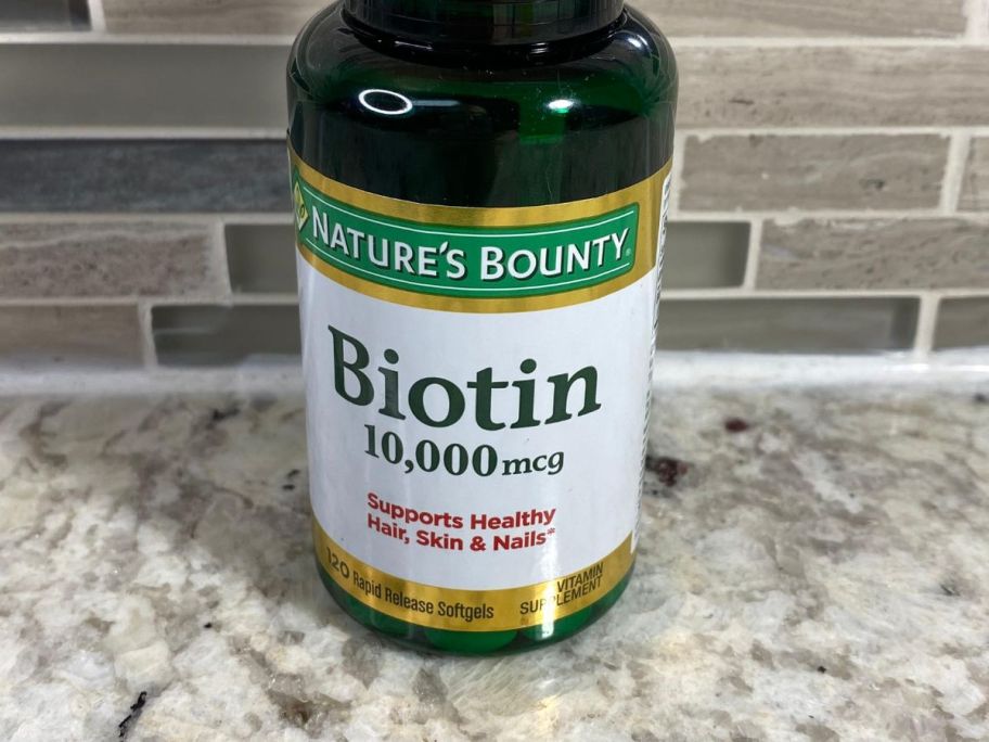 Nature's Bounty Biotin Rapid Release Softgels 120-Count bottle on counter