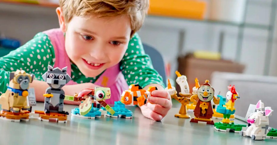 boy playing with disney duos lego set