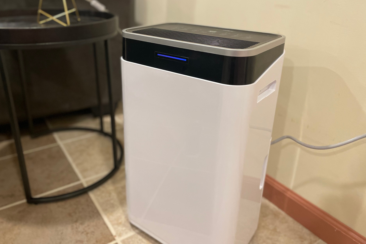 white rectangular dehumidifier next to coffee table