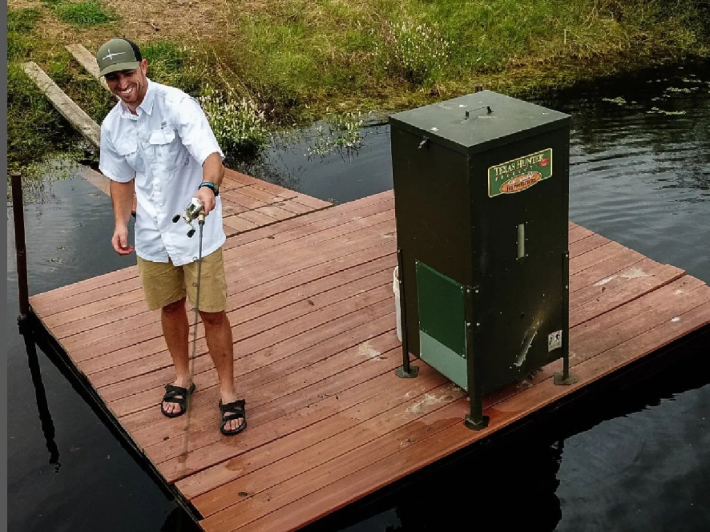 man fishing from a dock wearing a habit white fishing shirt