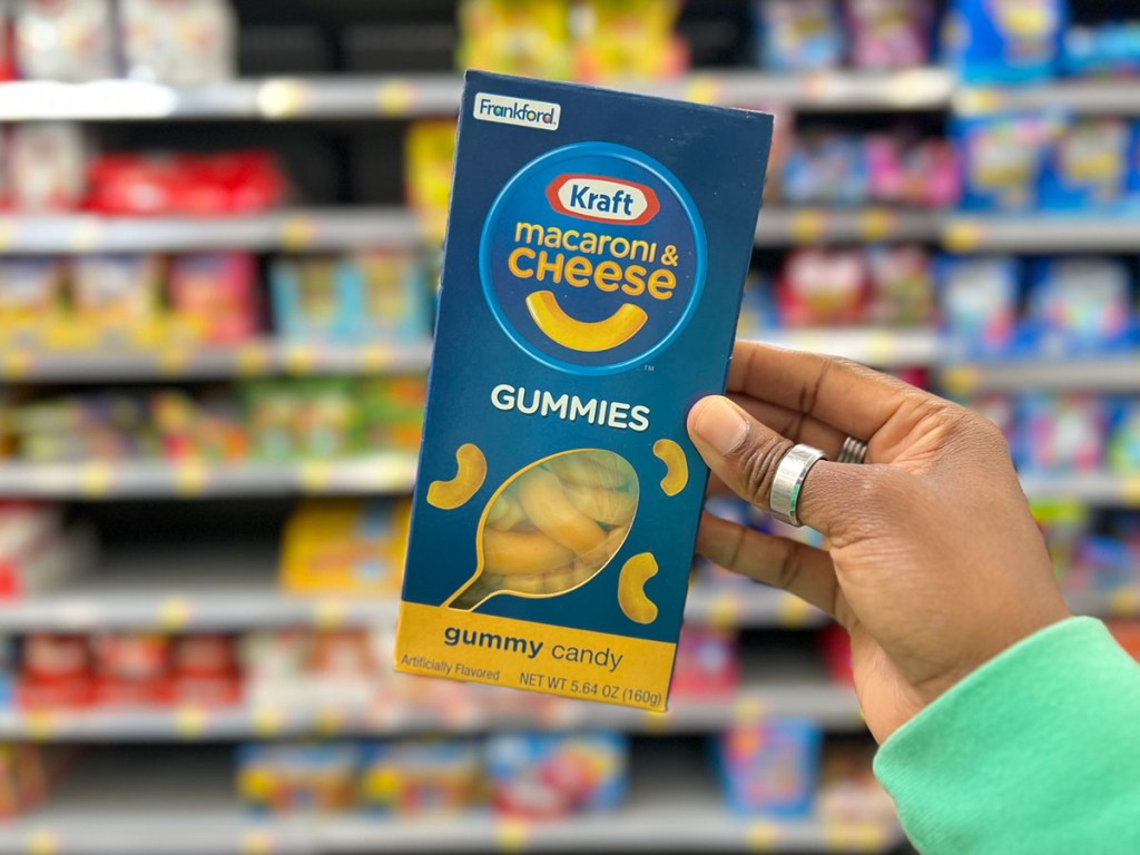 hand holding kraft mac n cheese gummy pack