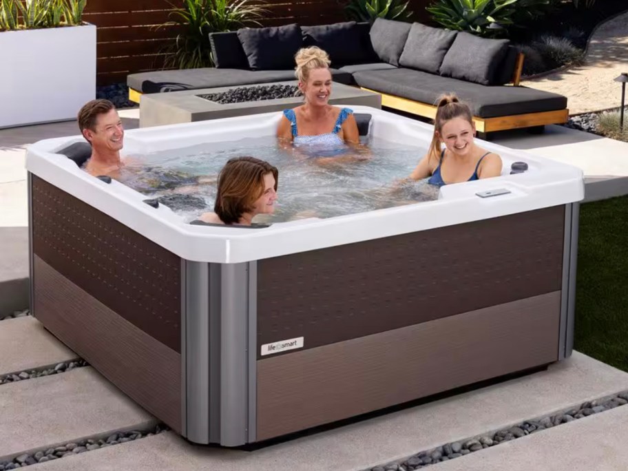 people sitting in brown hot tub