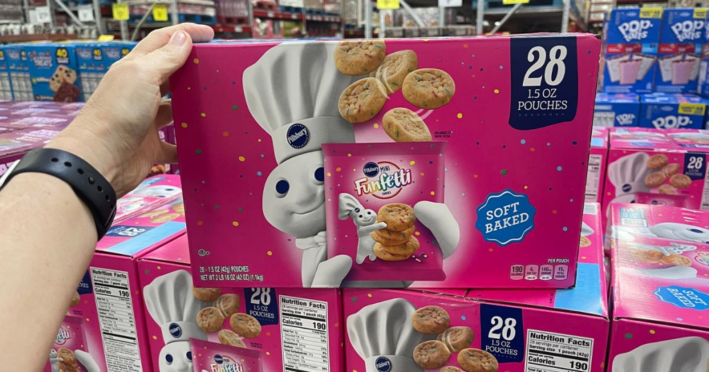 hand holding pillsbury funfetti cookies box