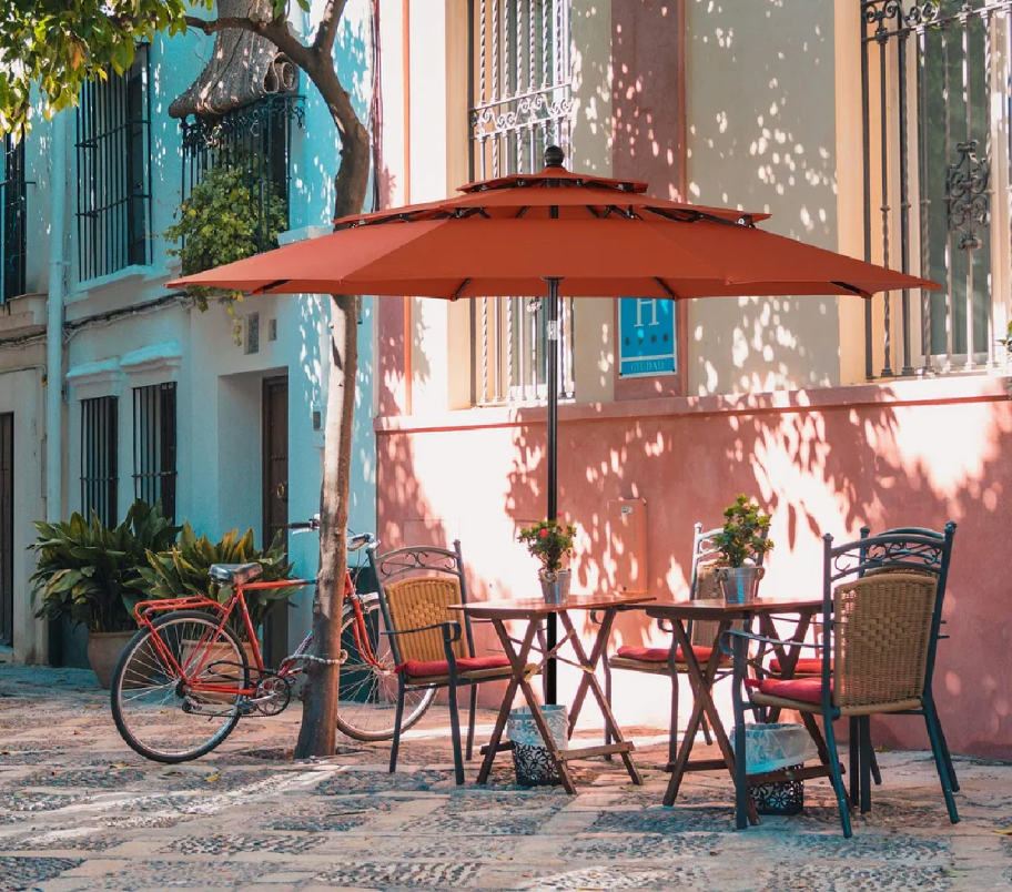 3 tiered patio umbrella from bed bath and beyond displayed on a charming street