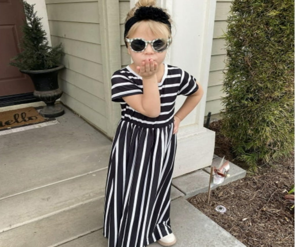 girl blowing a kiss while wearing a Arshiner Girls Dress