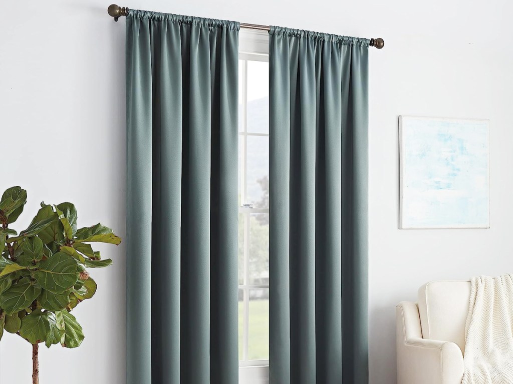 blue grey curtain panels in front of window