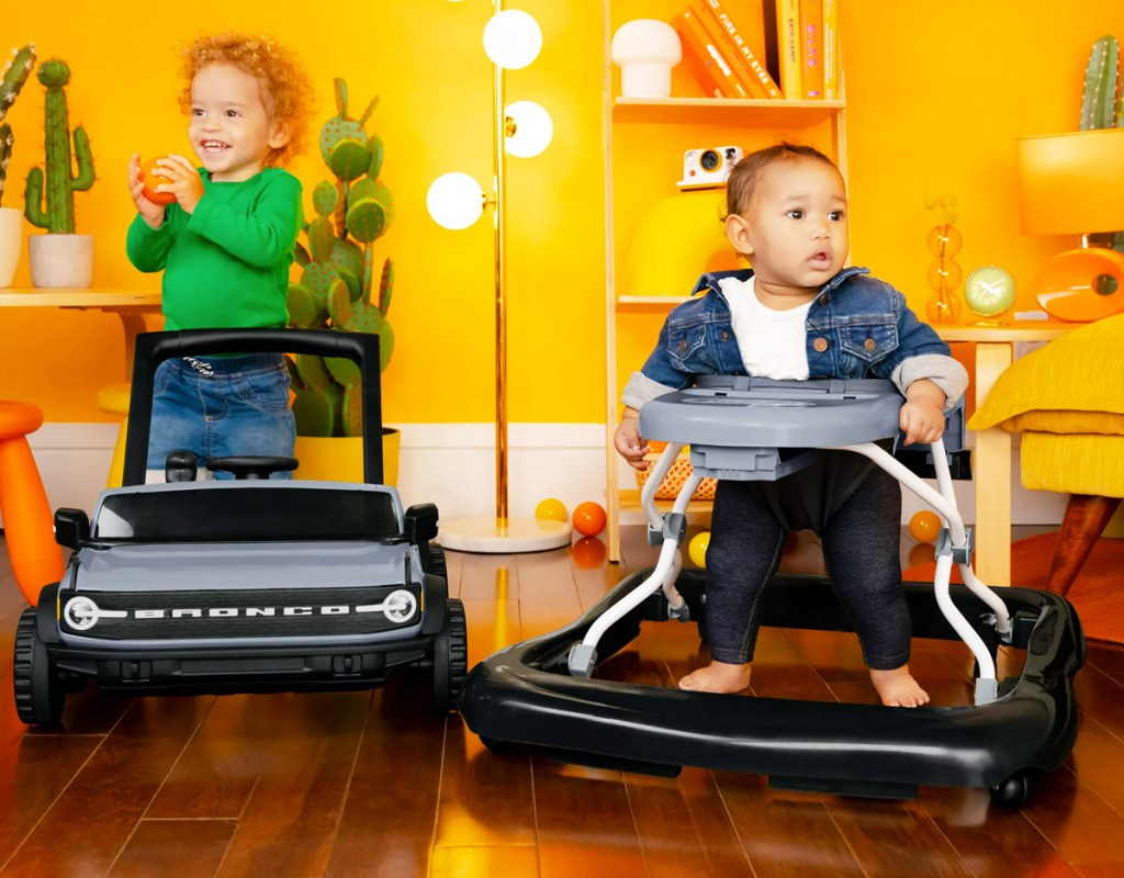 two kids playing with a ford bronco walker