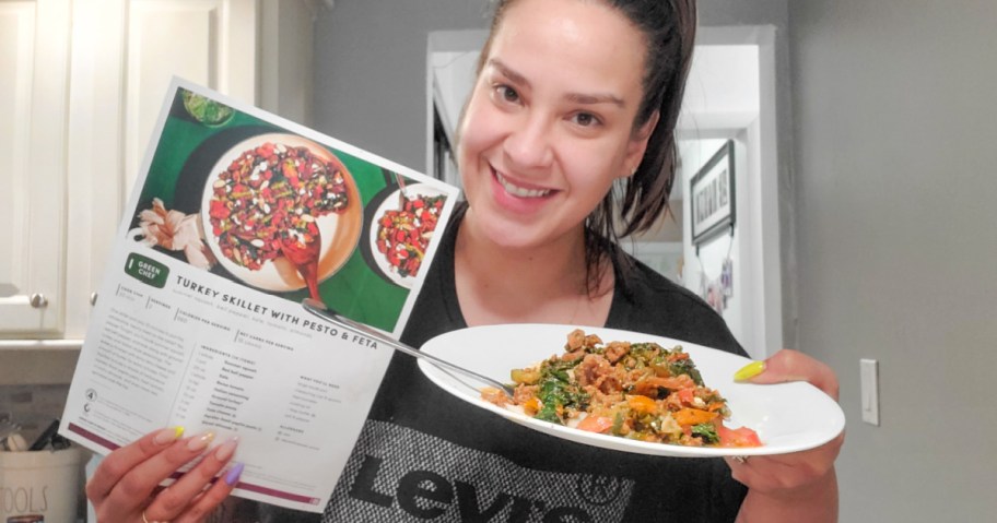 woman holding Green Chef meal and recipe card