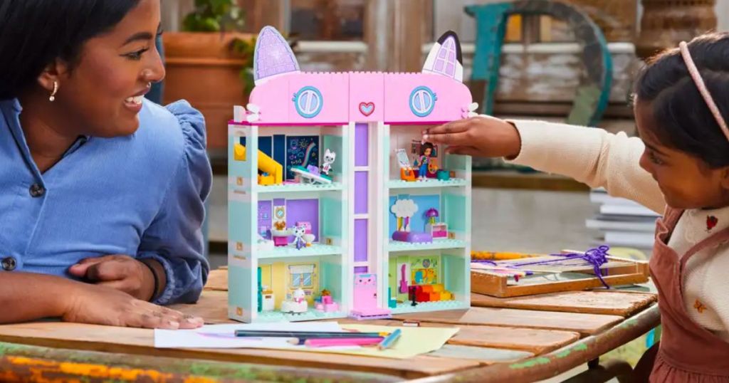 a mom and little girl playing with Lego gabbys dollhouse