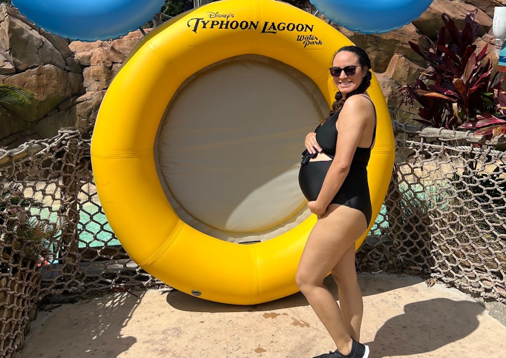 Pregnant woman wearing a maternity-friendly swimsuit from Aerie