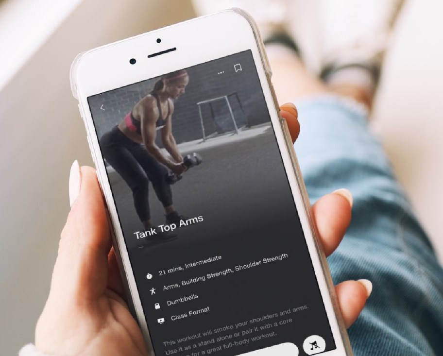 Person scrolling the Nike Training Club workout app free fitness apps