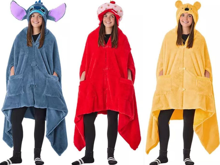 Stock images of women wearing a Stitch, Strawberry Shortcake, and Winnie the Pooh wearable blankets