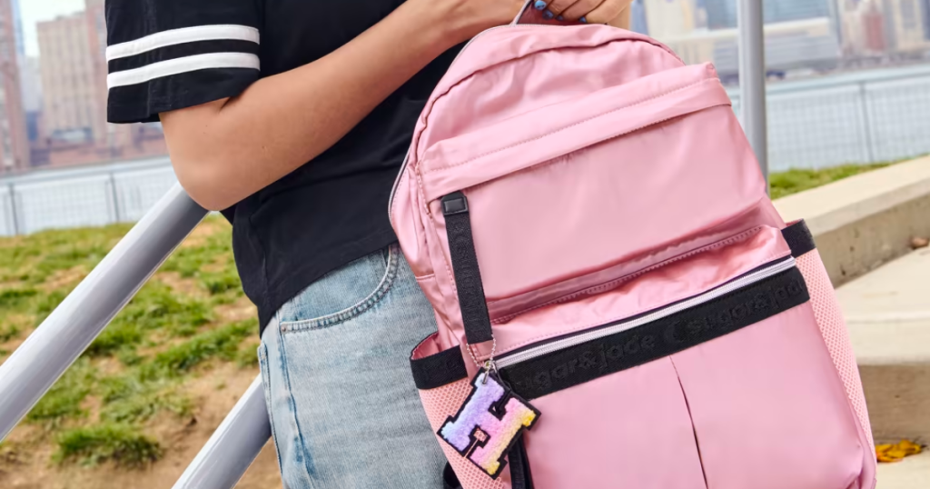 Sugar & Jade Backpack being held by Teen