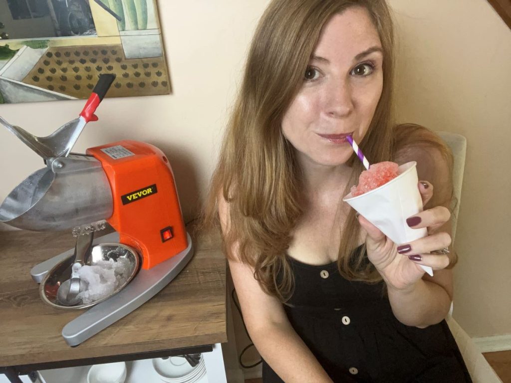 Woman drinking a snow cone