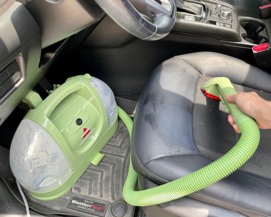 carpet cleaner cleaning inside car