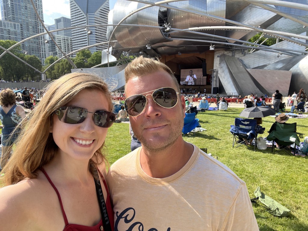 couple standing outside at outdoor music festival