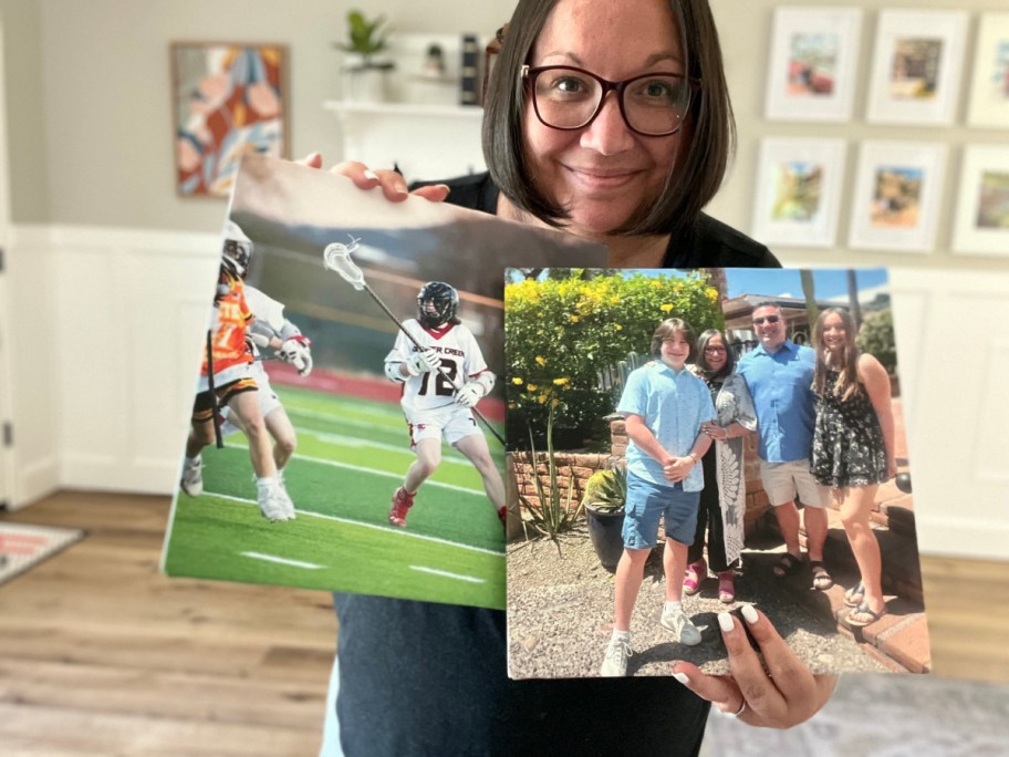 woman holding two canvas prints